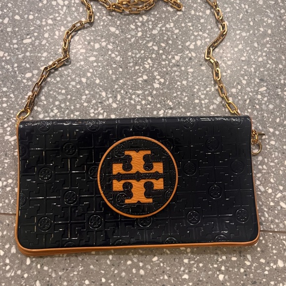 Tory Burch Handbags - Tory Burch Navy and Tan Embossed Clutch